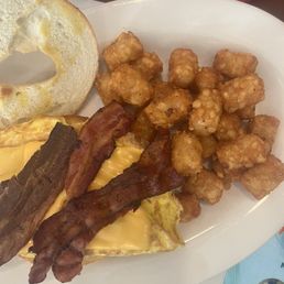 Bacon, egg and cheese bagel with hash browns Bacon, egg and cheese bagel with hash browns