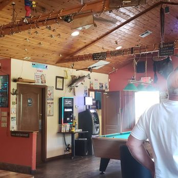 Hunter Creek Bar & Grill - a man sitting at a table - Sports Bars Near Me - Gold Beach, Oregon Hunter Creek Bar & Grill - a man sitting at a table - Sports Bars Near Me - Gold Beach, Oregon