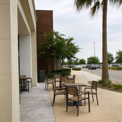 Barnes & Noble Booksellers - Outdoor front patio seating that's partially covered with outlets.