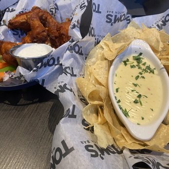 Tom's Watch Bar - Minneapolis - Buffalo wings and queso - Sports Bars Near Me - Minneapolis, Minnesota Tom's Watch Bar - Minneapolis - Buffalo wings and queso - Sports Bars Near Me - Minneapolis, Minnesota