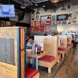 Midwood Smokehouse - Booth's seating and tables