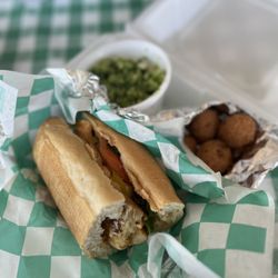 Simply Seafood Market & Cajun Diner - Grilled Cod Po Boy: includes lettuce, tomato, Remoulade. Broccoli and cheese + hush puppies on the side.