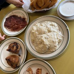 Ramblewood Diner - Side of corned beef hash, toasted blueberry muffin, side of bacon, full order of biscuits and gravy, order of onion rings w/ side of ranch
