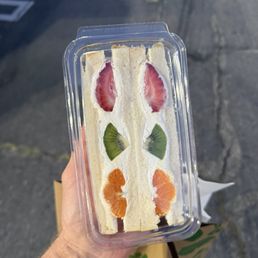 Fruit and whipped cream sandwich on fluffy milk bread. Yum.