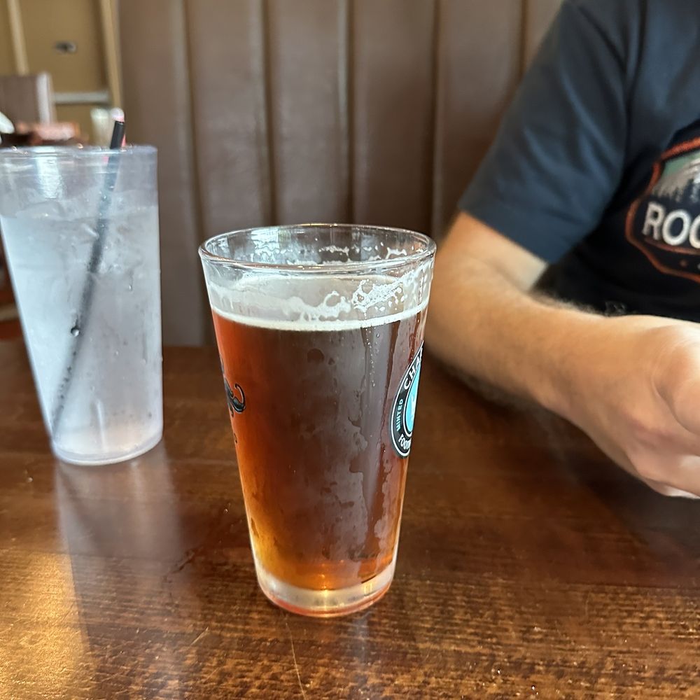 Crafty Burg'r - a glass of beer on a table - Burgers Near Me - Cornelius, North Carolina Crafty Burg'r - a glass of beer on a table - Burgers Near Me - Cornelius, North Carolina