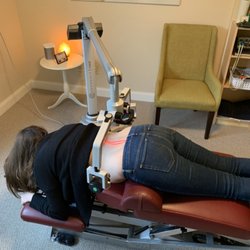 Chanhassen Wellness Chiropractic - A patient using the FX635 laser for back pain.  This laser is FDA approved to treat pain anywhere in the body.