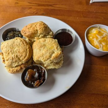 Lucy in the Rye - Biscuit flight with bacon, poblano and homemade strawberry jams, and a side of cheese grits - Breakfast & Brunch Near Me - Sylva, North Carolina