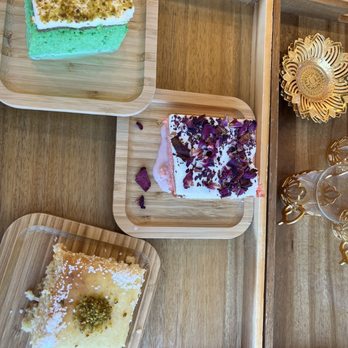 Qamaria Coffee - Cake selection (rose, pistachio, and coconut) - Coffee & Tea Near Me - Fullerton, California Qamaria Coffee - Cake selection (rose, pistachio, and coconut) - Coffee & Tea Near Me - Fullerton, California