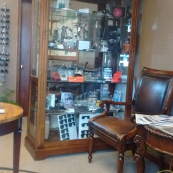 Susan Lee, OD - Cabinets clustered with decor and glasses for display in the waiting area - Optometrists Near Me - Watonga, Oklahoma Susan Lee, OD - Cabinets clustered with decor and glasses for display in the waiting area - Optometrists Near Me - Watonga, Oklahoma