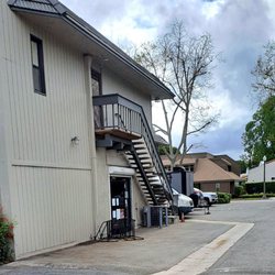 Entrance thru parking lot, behind First and C St