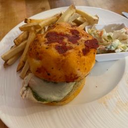 Yummy sandwich with homemade coleslaw and fries. On the 4th of July in the bar area. Madison was an amazing server!
