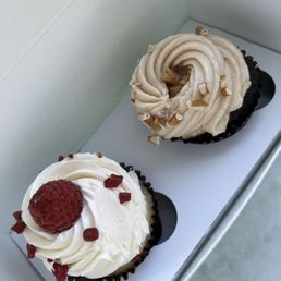 Vanilla raspberry cupcake and chocolate caramel cupcake