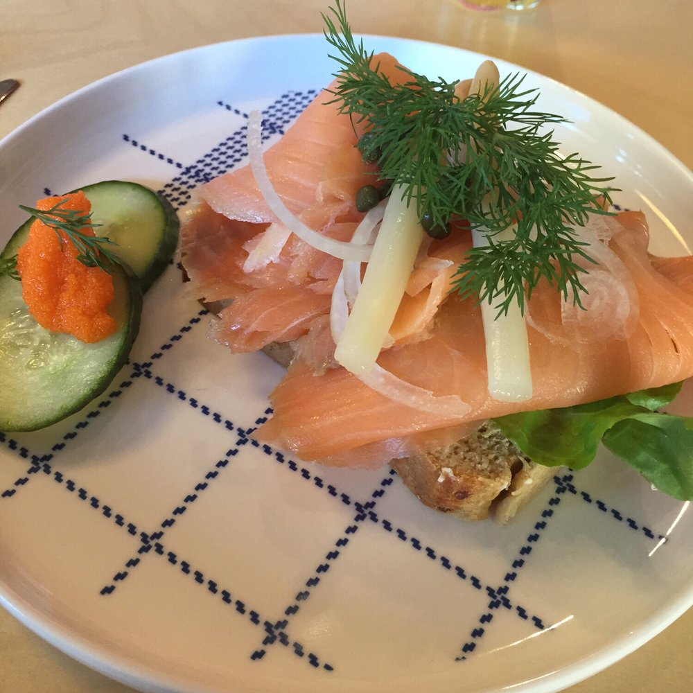 a plate with a sandwich and cucumbers a plate with a sandwich and cucumbers