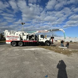 ACS Rooter One - Vac truck cleaning and clearing line from one manhole to the other.