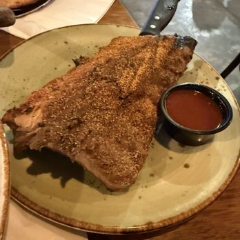 The Bear Paw Bar & Grill - 1/2 rack of ribs with the Cajun rub bbq sauce on the side - American Near Me - Anchorage, Alaska