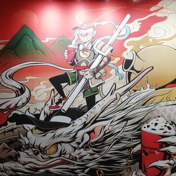 Fortune Tea - Monkey king drinking tea - The mural features a character riding a dragon, holding a cup of tea or beverage, with a background of mountains and swirling clouds. The artwork is detailed with bold lines and bright colors, including red, gold, and black, and includes the Fortune Tea logo in the top left corner. The scene combines traditional Asian motifs with modern artistic style, located inside Fortune Tea in Toronto. - Bubble Tea Near Me - Toronto, Ontario