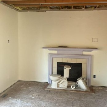 Gurr Brothers Construction - a fireplace in the middle of a room - General Contractors Near Me - Troy, Michigan Gurr Brothers Construction - a fireplace in the middle of a room - General Contractors Near Me - Troy, Michigan