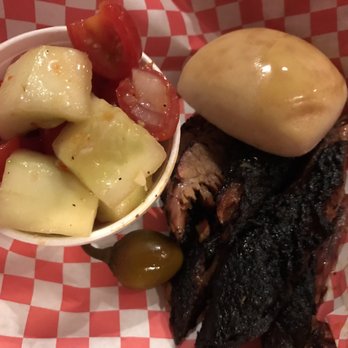 The Smokin Pig - Sliced brisket sandwich with a roll instead of a bun. Tomato and cucumber salad on the side. Delicious! - Barbeque Near Me - Pendleton, South Carolina The Smokin Pig - Sliced brisket sandwich with a roll instead of a bun. Tomato and cucumber salad on the side. Delicious! - Barbeque Near Me - Pendleton, South Carolina
