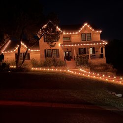 Christmas Light Helpers - Lights on a house