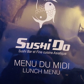 Sushi Do - a man taking a picture of the menu - Sushi Bars Near Me - Laval, Quebec Sushi Do - a man taking a picture of the menu - Sushi Bars Near Me - Laval, Quebec