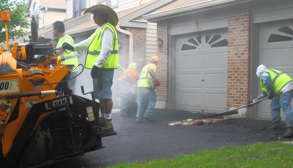 J&J Pavement Repairs crew applying sealcoating