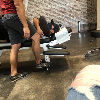 Ideal Body Chiropractic - The chiropractor beginning to realign him. - Chiropractors Near Me - Fullerton, California