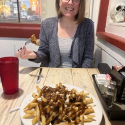 Poutine and a happy girl.