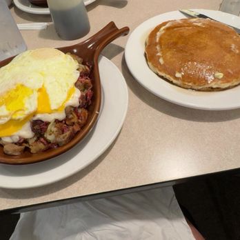 Cackleberries - Skillet with meats, potatoes, eggs and sausage gravy with side of pancakes. - Breakfast & Brunch Near Me - Terre Haute, Indiana