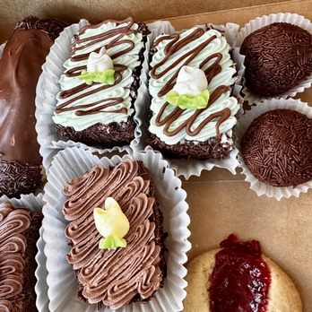 Leslie's Pastries - Eclair, chocolate and chocolate mint rum cakes, rum balls, and a raspberry thumbprint cookie - Bakeries Near Me - Holladay, Utah