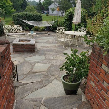 Garden Creations - a patio with a hammock and chairs - Landscaping Near Me - Red Lion, Pennsylvania Garden Creations - a patio with a hammock and chairs - Landscaping Near Me - Red Lion, Pennsylvania