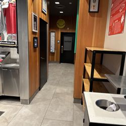 Raising Cane's Chicken Fingers - Restroom hallway