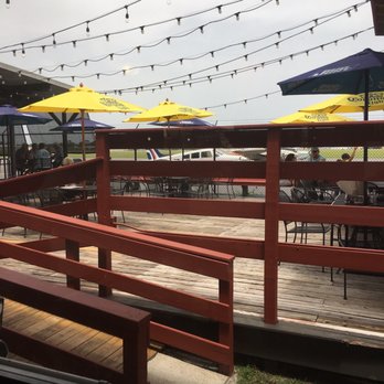 Airport Restaurant - tables and umbrellas on the deck - Lounges Near Me - DeLand, Florida Airport Restaurant - tables and umbrellas on the deck - Lounges Near Me - DeLand, Florida