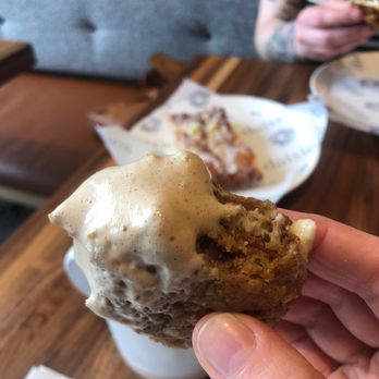 Daisies - Cream pie dunked in a cappuccino, coffee cake in the background - Pasta Shops Near Me - Chicago, Illinois