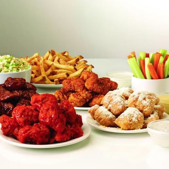 Wingstop - a variety of fried foods on a table - Chicken Wings Near Me - Valley, Alabama Wingstop - a variety of fried foods on a table - Chicken Wings Near Me - Valley, Alabama