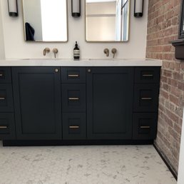 Master Bathroom cabinets & Calacatta Gold countertops. Brass hardware.