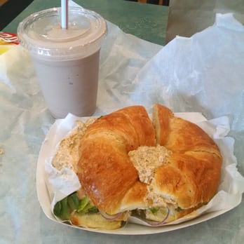 Ain't She Sweet Cafe - Jerk chicken salad sandwich on a croissant! With a muscle up shake on the side - Coffee & Tea Near Me - Chicago, Illinois Ain't She Sweet Cafe - Jerk chicken salad sandwich on a croissant! With a muscle up shake on the side - Coffee & Tea Near Me - Chicago, Illinois