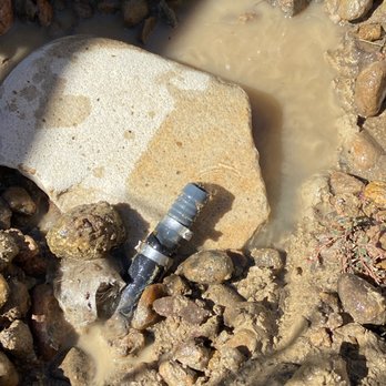 Outdoor Craftsmen - a water spout in a muddy area - Landscape Architects or Designers Near Me - Erie, Colorado
