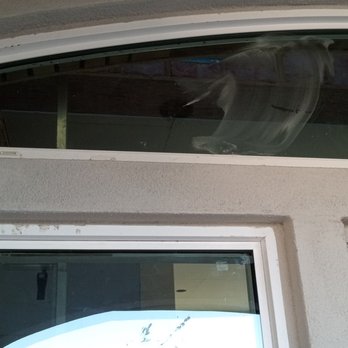 Professional Plastering Contractors - Stucco on windows and window frames because they refused to mask them off. - Stucco Services Near Me