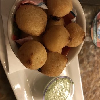 Bahama Breeze - Fried yucca bites stuffed with cheese and avocado cream sauce, so delicious! - Bars Near Me - Gainesville, Florida Bahama Breeze - Fried yucca bites stuffed with cheese and avocado cream sauce, so delicious! - Bars Near Me - Gainesville, Florida