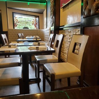 Tainos Cafe & Lounge - tables and chairs - Latin American Near Me - Coram, New York Tainos Cafe & Lounge - tables and chairs - Latin American Near Me - Coram, New York