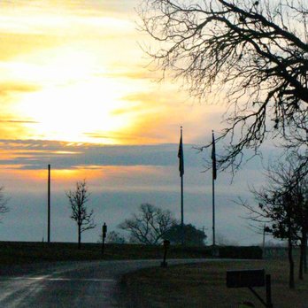 Old River Road RV Resort - Sunrise over the American and Texas flags at the entrance to the park. - RV Parks Near Me - Kerrville, Texas Old River Road RV Resort - Sunrise over the American and Texas flags at the entrance to the park. - RV Parks Near Me - Kerrville, Texas