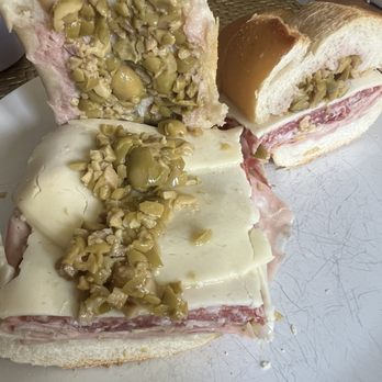 IL Posto Eatery - Muffuletta Sandwich Sweet soppressata, mortadella, capicola, provolone, marinated mushroom & olive salad. $14.95 - Italian Near Me - Clifton, New Jersey