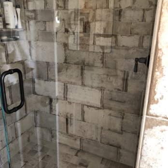 Dee Tile - a shower with a glass door - Flooring Near Me - Salinas, California