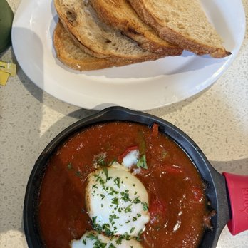 Kitch Cafe - Shashuka skillet and sourdough bread above.  You have a choice of sourdough or multi-grain bread? - Breakfast & Brunch Near Me - Fullerton, California