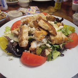 Fish over Greek salad. Grouper.. Fish over Greek salad. Grouper..