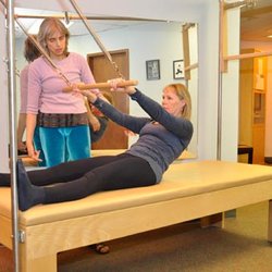 Body Technic Systems - Body Technic Systems owner, physical therapist, and personal fitness trainer, Sunday Homitz working one-on-one with a client.