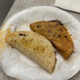 Left: soft taco birria. Right: quesa taco birria Left: soft taco birria. Right: quesa taco birria