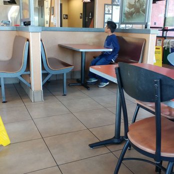 Jack in the Box - W....T.....F..... One of the employee's kids just sitting by himself. - Burgers Near Me - Seattle, Washington