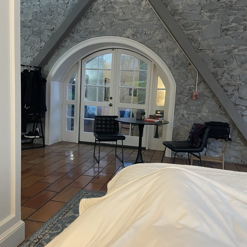 A view from the bed to the not so private patio. A building with a window can be seen next door and the wall is only about 5' tall. A view from the bed to the not so private patio. A building with a window can be seen next door and the wall is only about 5' tall.
