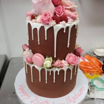 Sweets By Design - a chocolate cake decorated with pink roses - Cupcakes Near Me